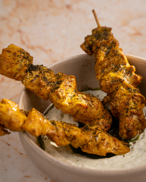 Grilled Auri skewers served with a dip